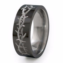 Titanium Ring with a barbed wire design neatly carved into the surface giving the Taboo Titanium ring a cool, rebel-like appeal.